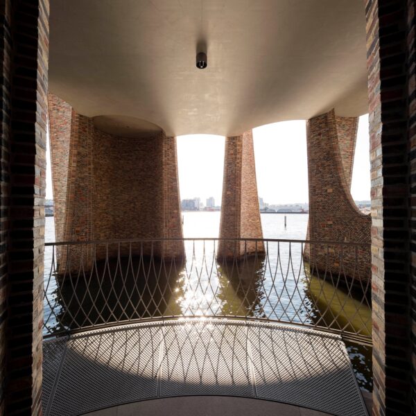 Fjord reflections shimmer across raw concrete floors